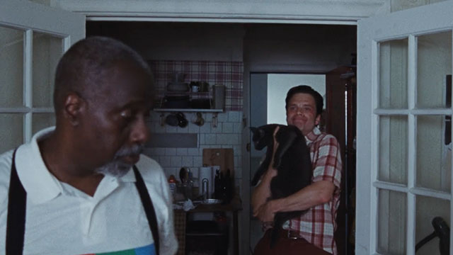 A Different Man - blue cat held by Edward Sebastian Stan lap with Ollie Billy Griffith