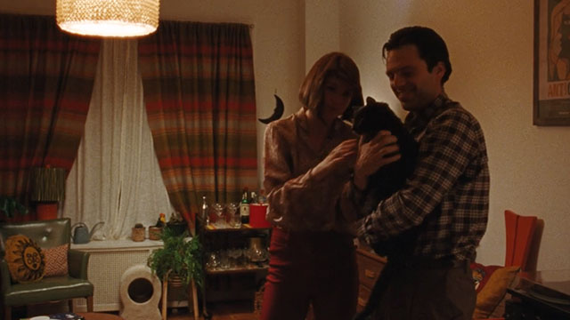 A Different Man - blue cat held by Edward Sebastian Stan lap with Ingrid Renate Reinsve