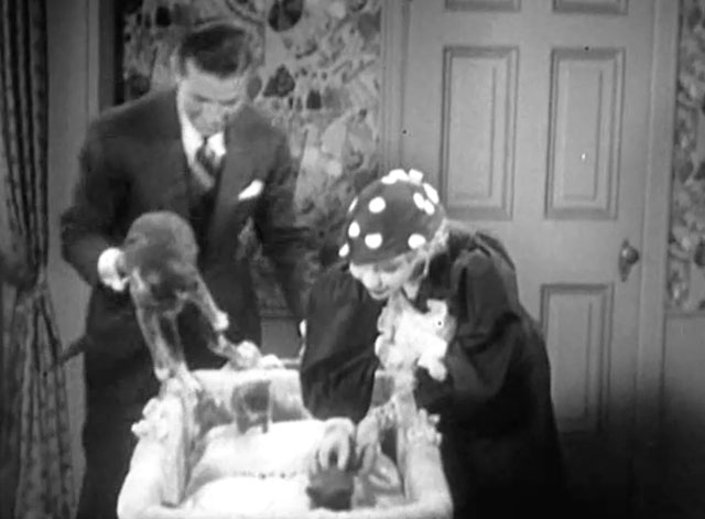 Disgraced - Gay Helen Twelvetrees and Kirk Bruce Cabot looking at kittens and mama cat in bassinet