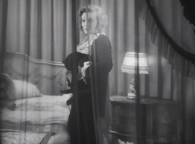 Dishonored - long-haired black cat Blackie being held by Marie Marlene Dietrich