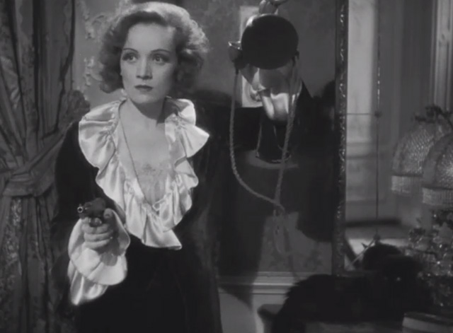 Dishonored - long-haired black cat Blackie on stand beside Marie Marlene Dietrich with disconnected phone