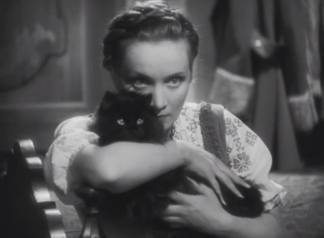 Dishonored - long-haired black cat Blackie being clutched by Marie Marlene Dietrich looking intense