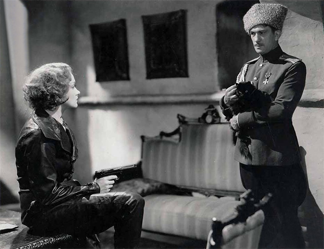 Dishonored - long-haired black cat Blackie being held by Colonel Kranau Victor McLaglen with Marie Marlene Dietrich publicity still