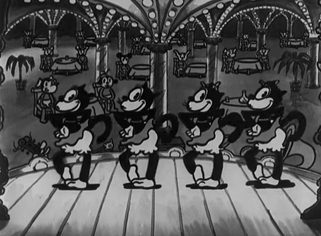 Dizzy Dishes - four black cats in a chorus line