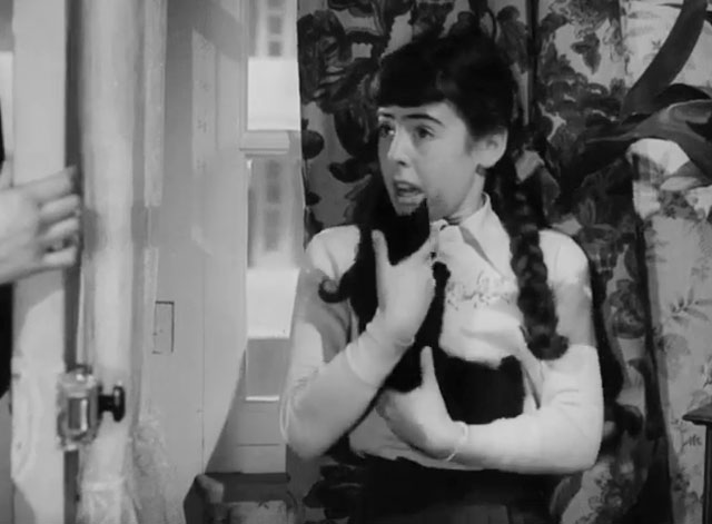 The Dog and the Diamonds - Linda Molly Osborne holding black kitten Frisky