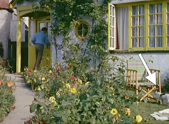 Donald Sinden at Home - actor walking into house with calico cat following a ways behind
