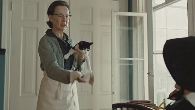 Doubt - Mrs. Carson Susan Blommaert holding tuxedo cat and dead mouse
