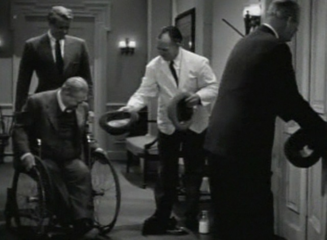 Dr. Gillespie's Criminal Case - Dr. Gillespie looks at kitten in hallway