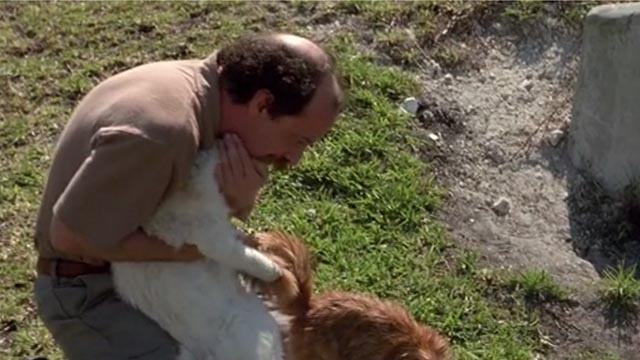 Drop Zone - Leedy Michael Jeter hugging white cat Agnes with long-haired orange tabby Buford