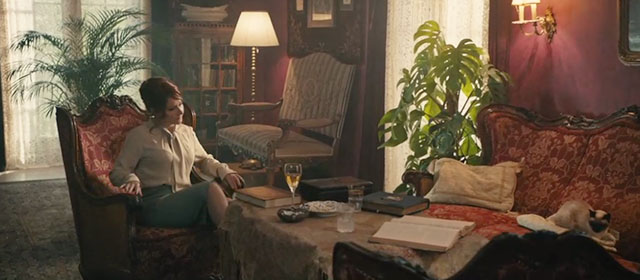 The Duke of Burgundy - Siamese cat sitting on couch across from Cynthia Sidse Babett Knudsen