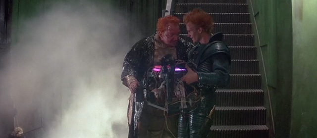 Dune - Baron Vladimir Harkonnen Kenneth McMillan and Feyd Rautha Sting at foot of stairs with hairless white cat in contraption