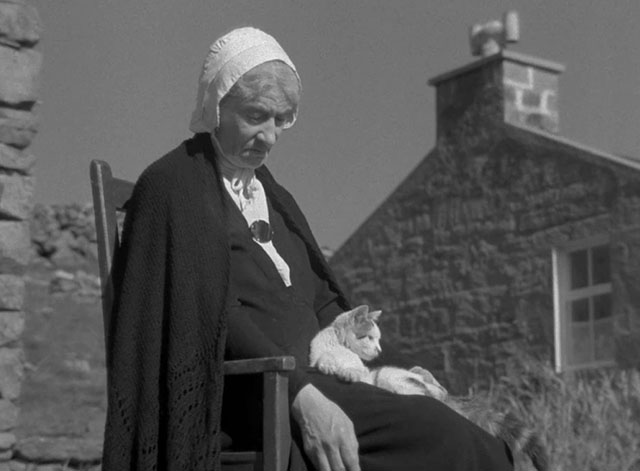 The Edge of the World - grandmother Jean Kitty Kirwan sleeping in chair with tabby and white cat on lap