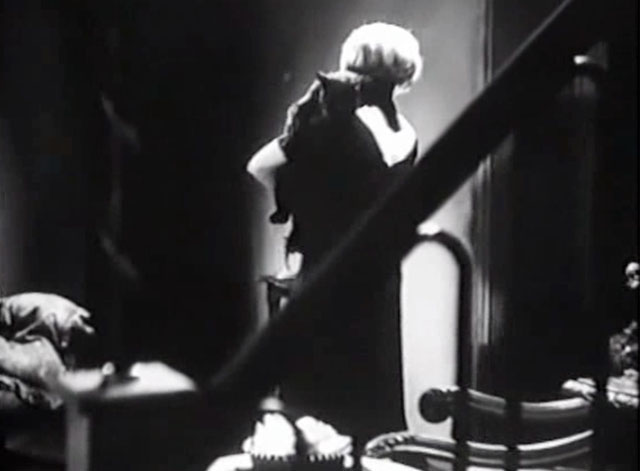 Eerie Tales - Unheimliche Geschichten - Betty Roma Bahn carrying black cat over shoulder