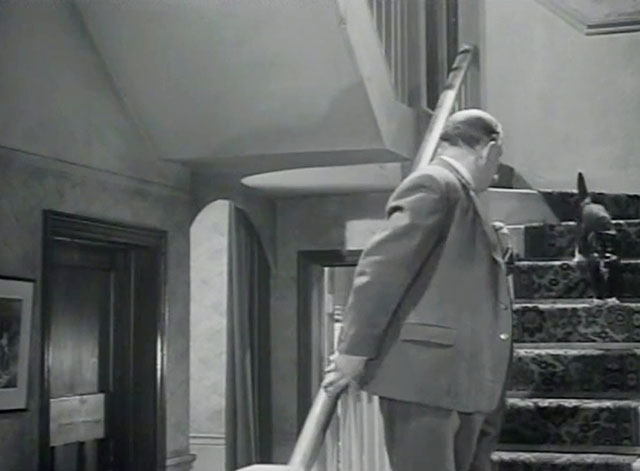 The Embezzler - Henry Charles Victor on stairs with tuxedo cat