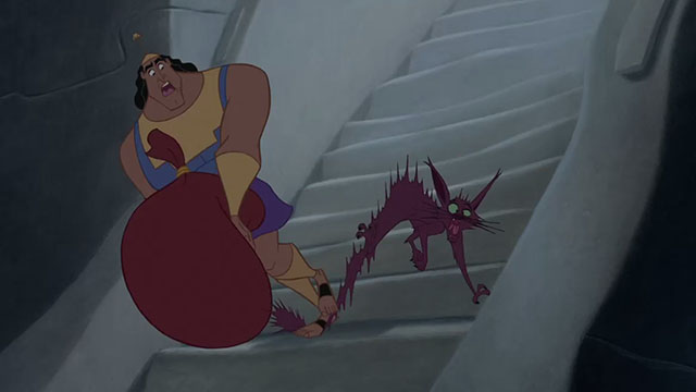 The Emperor's New Groove - cartoon purple cat being stepped on by Kronk on stairs
