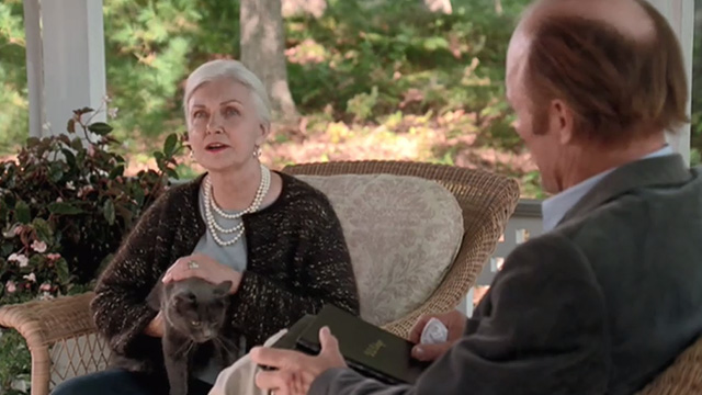 Empire Falls - long haired gray cat Timmy jumping up in Francine Joanne Woodward lap with Miles Ed Harris