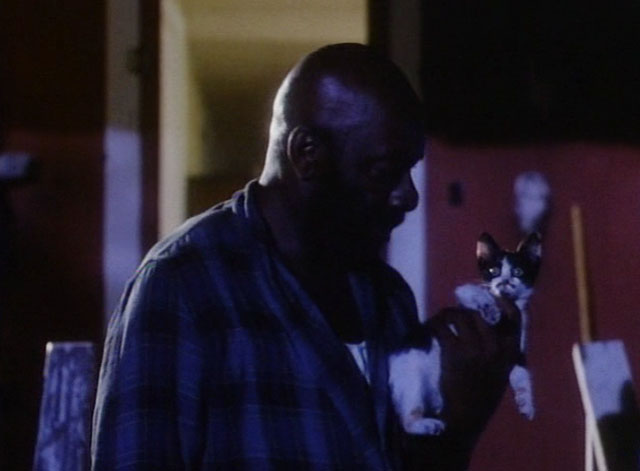 The Enchanted - calico kitten held by Booker Julius Harris