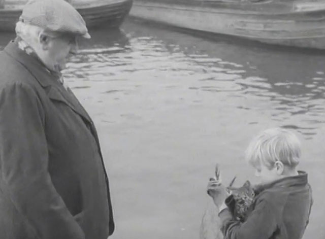 The End of the Road - Barney David Hannaford holding soaked tabby kitten with Mick Finlay Currie