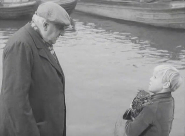 The End of the Road - Barney David Hannaford holding soaked tabby kitten with Mick Finlay Currie
