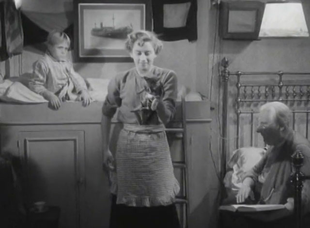 The End of the Road - Molly Naomi chance holding up tabby kitten with Barney David Hannaford and Mick Finlay Currie
