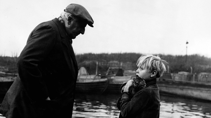 The End of the Road - Barney David Hannaford holding soaked tabby kitten with Mick Finlay Currie