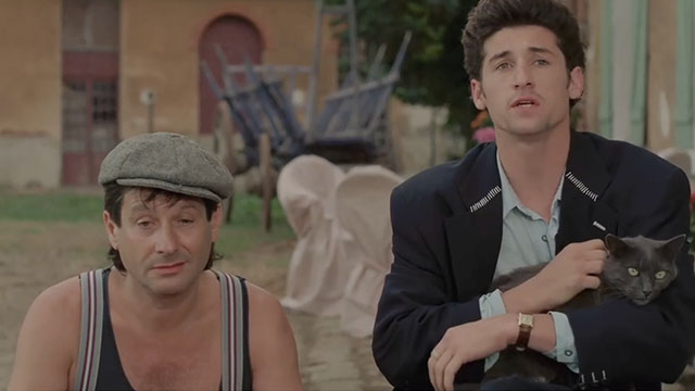 Face the Music - Tom sitting with Charlie Patrick Dempsey holding large gray cat Thelonious Gros Minet