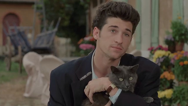 Face the Music - Charlie Patrick Dempsey holding large gray cat Thelonious Gros Minet