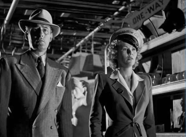 The Falcon in Hollywood - Falcon Tom Conway and Billie Veda Ann Borg with black cat on top of shelves