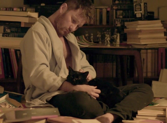 Family Life - black cat Mississippi with Martin Jorge Becker in messy library