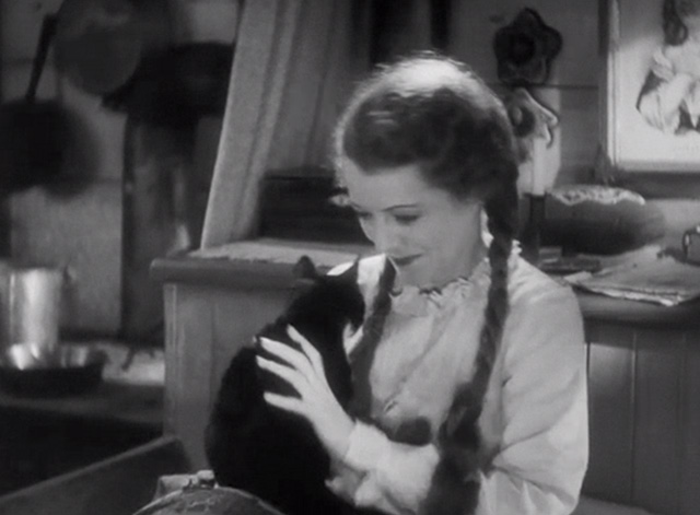 The Farmer Takes a Wife - Molly Janet Gaynor looking at tuxedo kitten in bed