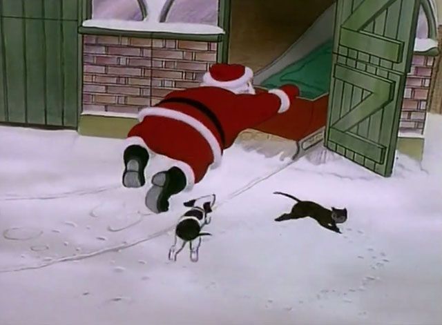 Father Christmas - dog chasing cat in circles as sleigh is put away