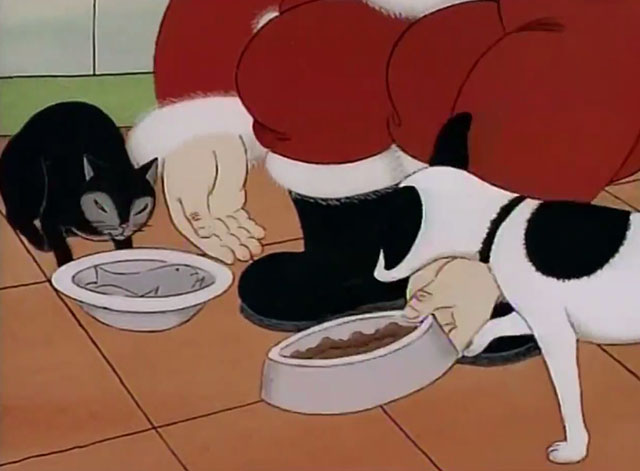 Father Christmas - feeding black cat and dog