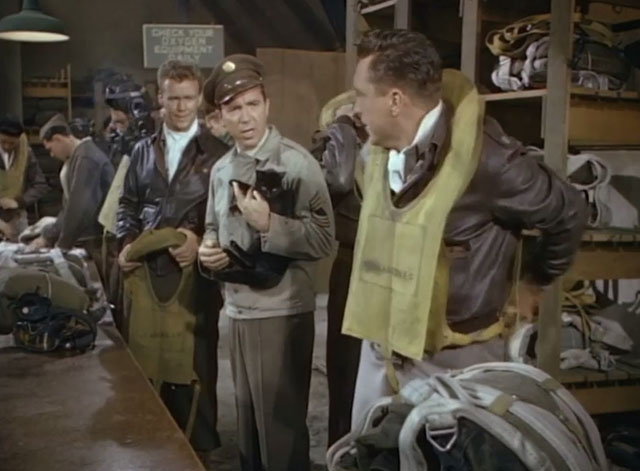 Fighter Squadron - fighter pilots looking at Dolan Tom D'Andrea holding black cat
