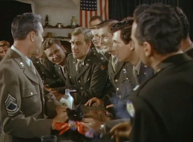 Fighter Squadron - black cat with ribbon on bar with fighter pilots, Dolan Tom D'Andrea and Rock Hudson