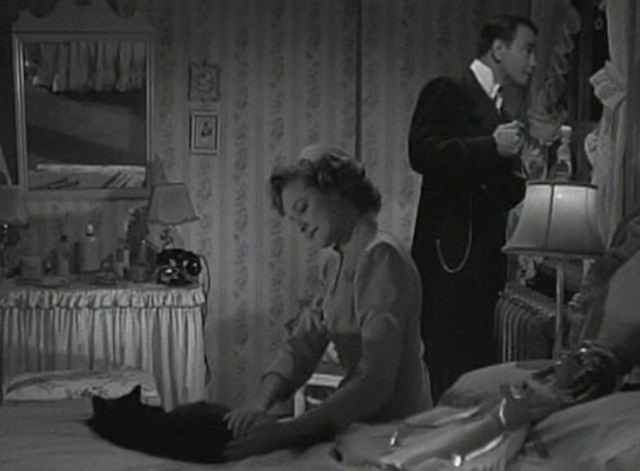 Fingers at the Window - black cat on bed