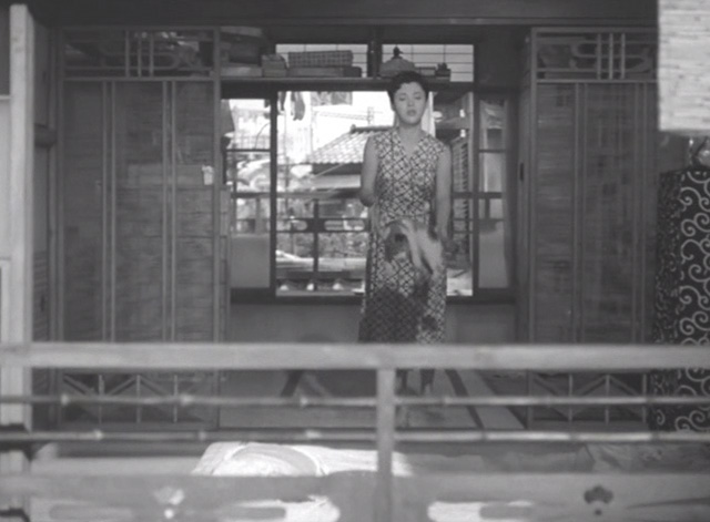 Flowing - daughter tossing calico Japanese Bobtail Ponko outside