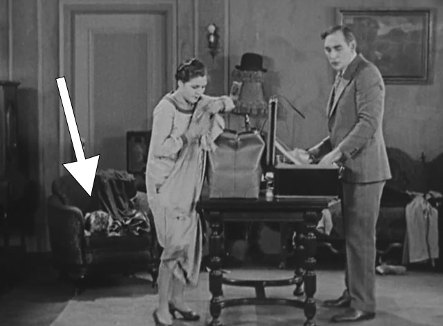 Forgotten Sweeties - longhair tabby cat on chair behind Ira Mitchell Lewis and Shirley Palmer