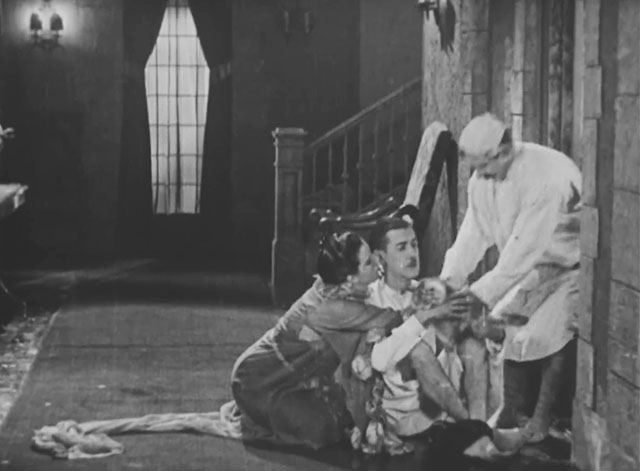 Forgotten Sweeties - longhair tabby cat being handed to Thurston Charley Chase and Lillian Anita Garvin by neighbor James Finlayson