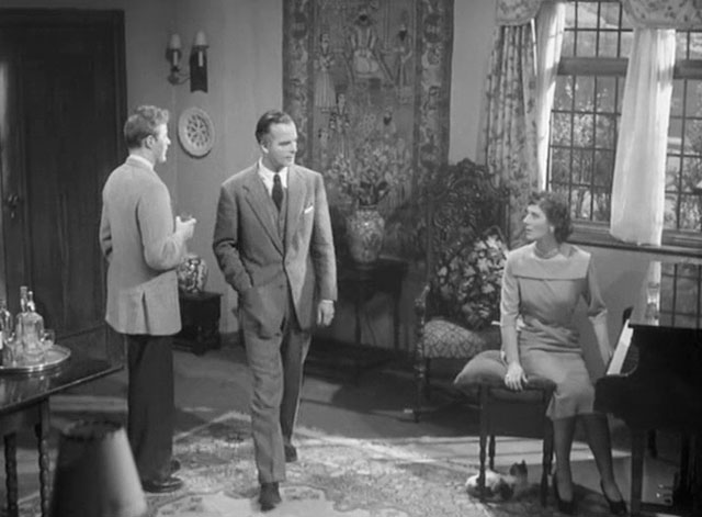 Four Days - Francis Hugh McDermott, Lucienne Kathleen Byron and Johnny Peter Reynolds in room with calico tabby cat beneath piano stool