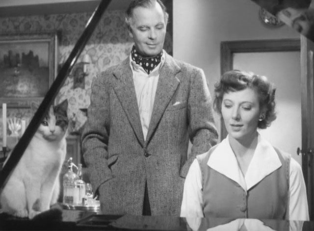 Four Days - Francis Hugh McDermott and Lucienne Kathleen Byron at piano with calico tabby cat