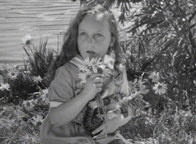 Frankenstein - little Maria holding tabby cat looking surprised