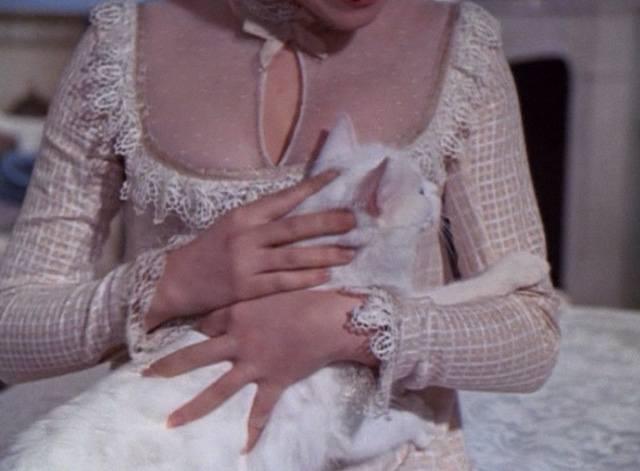 Frankenstein: The True Story - white cat Constantine being petted in lap