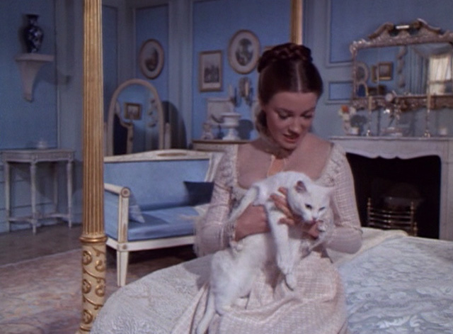 Frankenstein: The True Story - Prima Jane Seymour petting white cat Constantine on lap