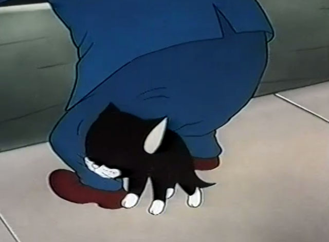 Frightday the 13th - cartoon black kitten Lucky rubbing against man's leg