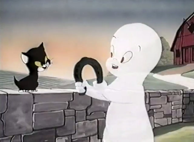 Frightday the 13th - cartoon black kitten Lucky given horseshoe by Casper the Ghost
