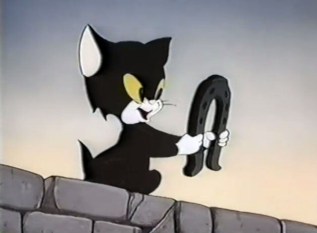 Frightday the 13th - cartoon black kitten Lucky with horseshoe
