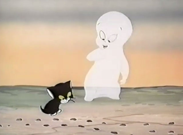 Frightday the 13th - cartoon black kitten Lucky with Casper the Ghost pointing to rabbit tracks