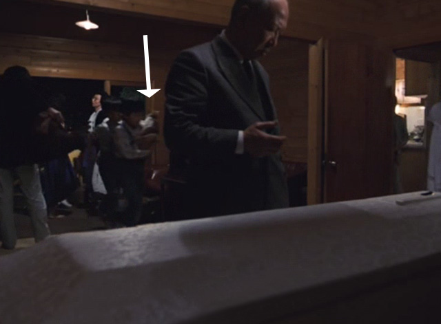 The Funeral - boy carrying orange and white cat Kichi into house