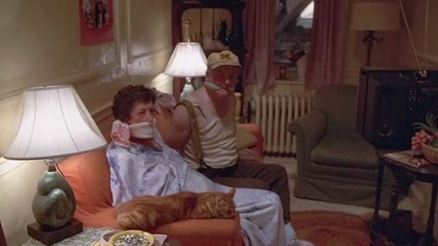 The Fury - orange tabby cat on arm of couch with tied up Mr. Nuckells Gordon Jump and Mrs. Nuckells Jane Lambert