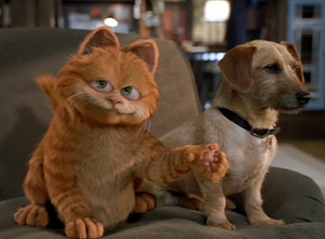 Garfield the Movie - Garfield cat and Odie dog on chair